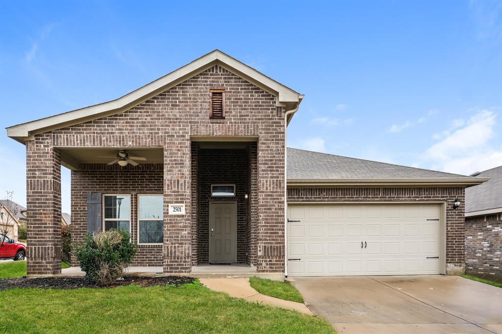 front view of a house with a yard