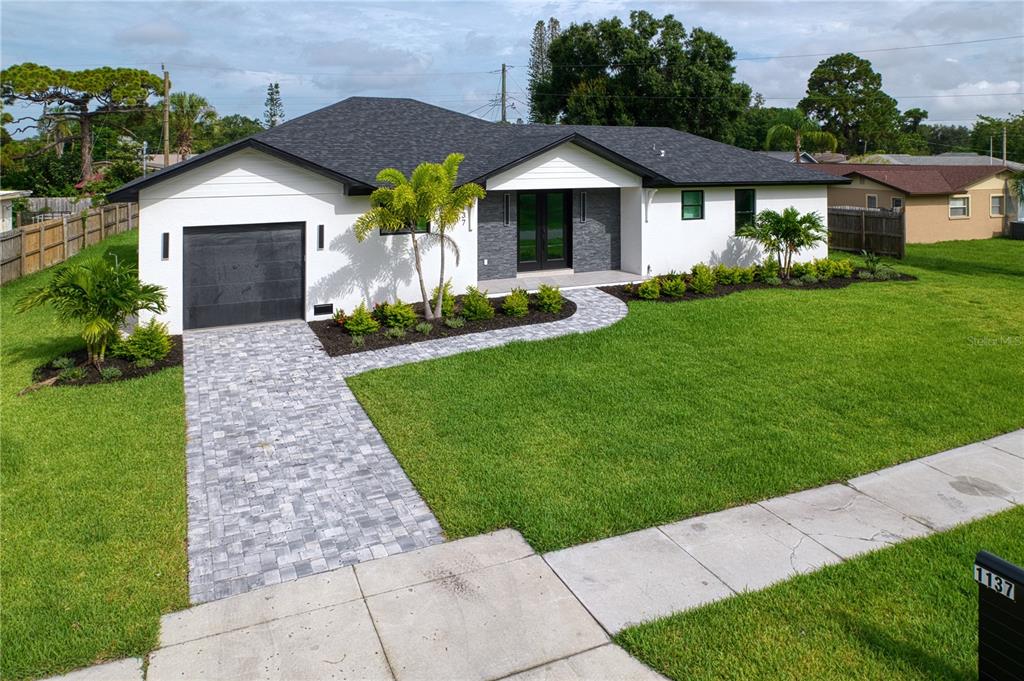 a front view of a house with a yard