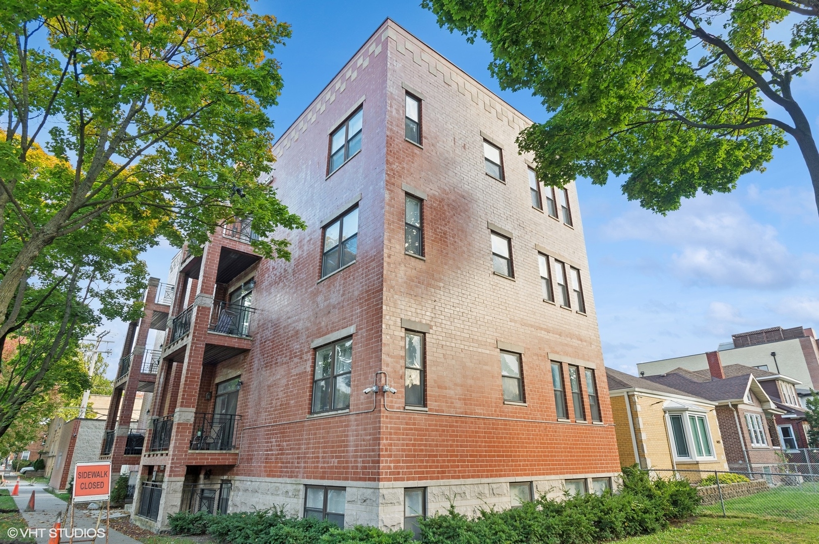 a view of a building next to a yard