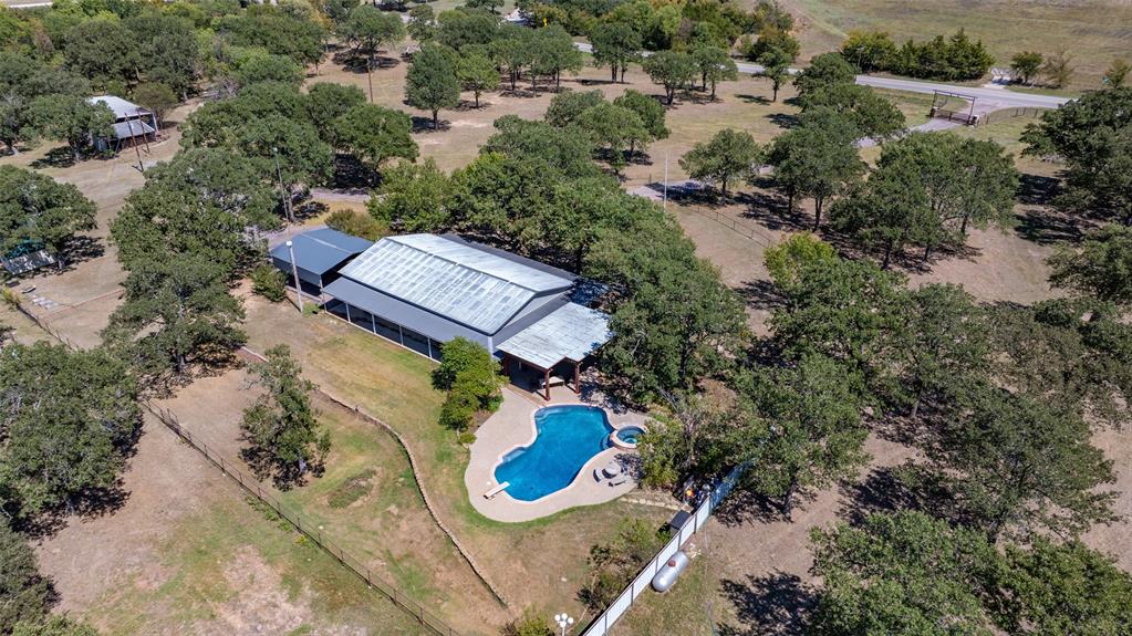 an aerial view of a house with a yard