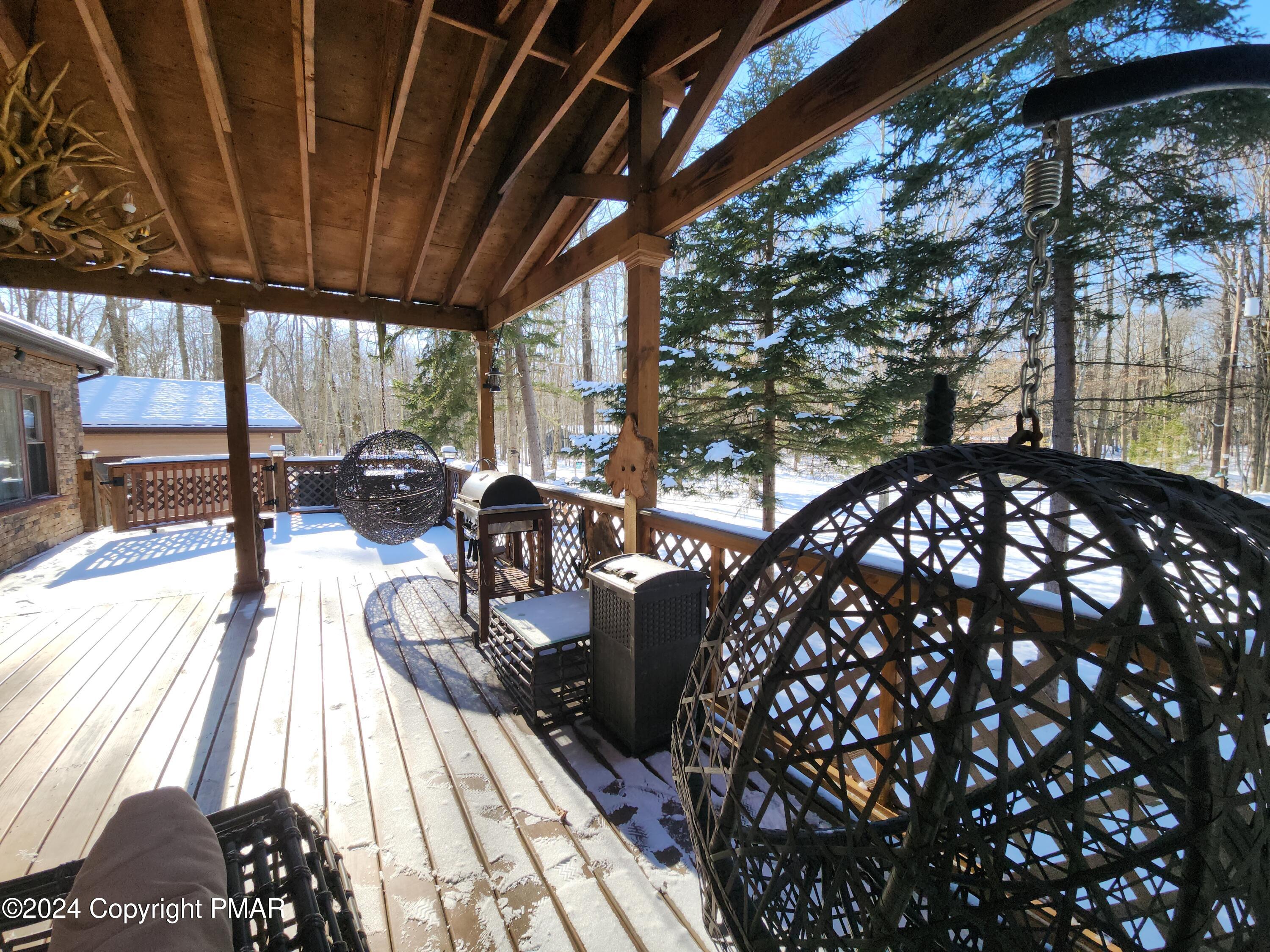 a balcony view with a seating space