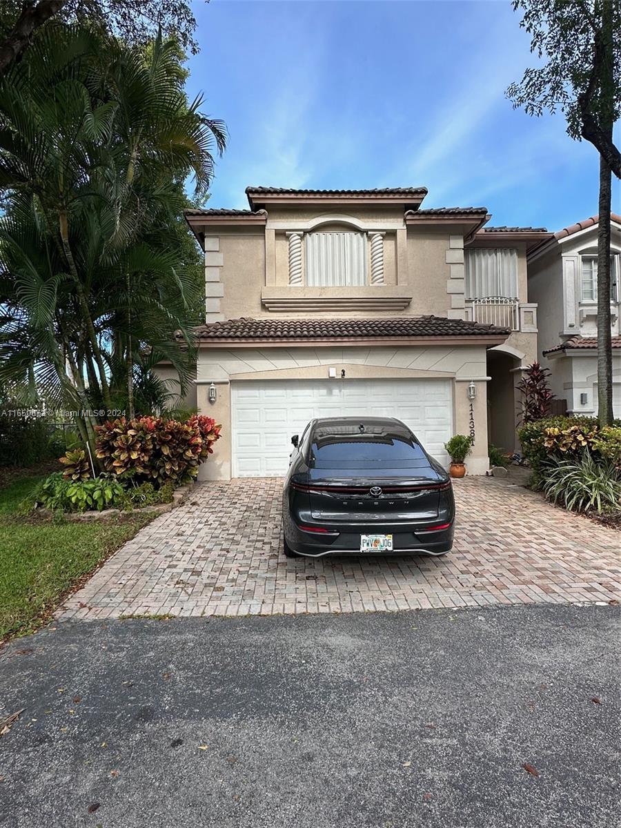 a car parked in front of a house