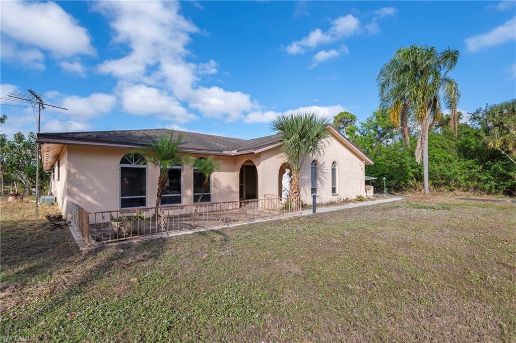 View of front of property with a front lawn