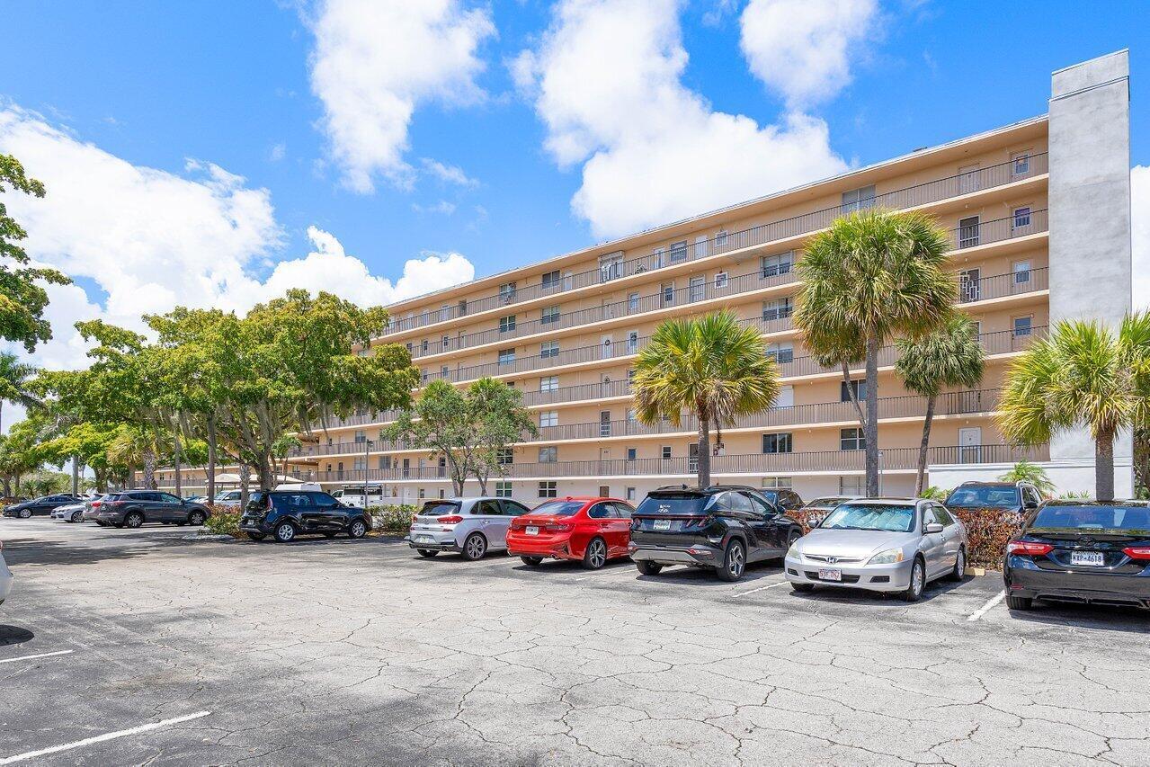 a view of a cars parked in front of a building