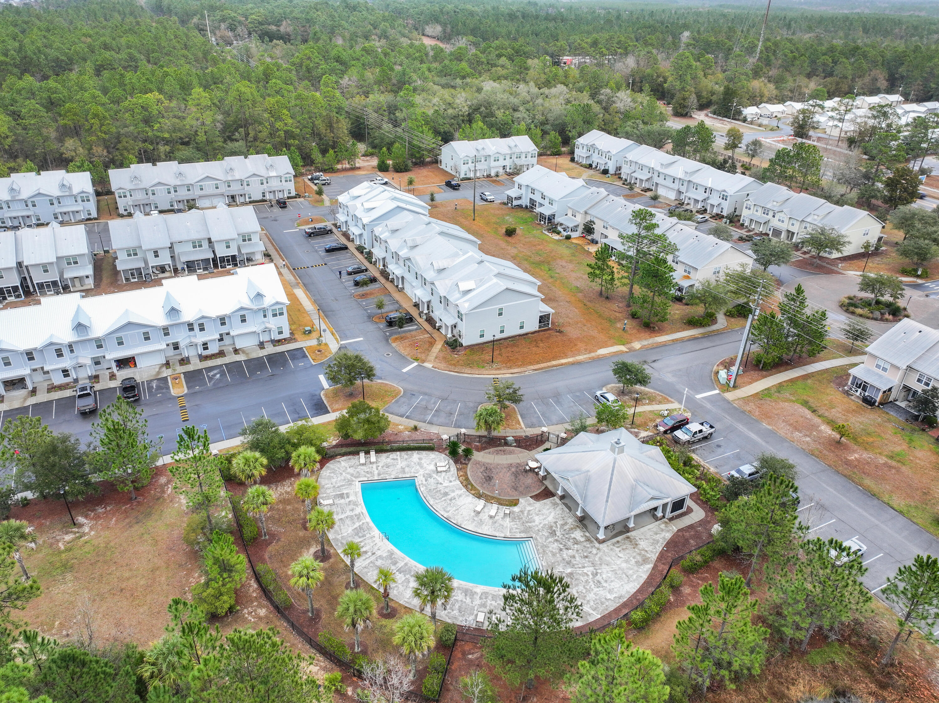 an aerial view of residential houses with outdoor space