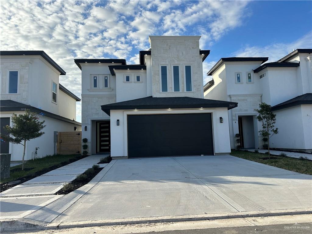 a front view of a house with a garage