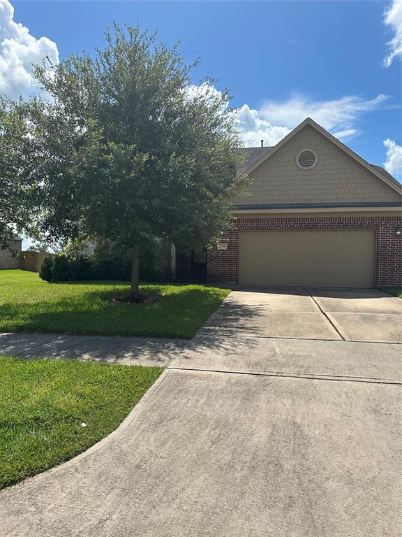 a front view of a house with yard