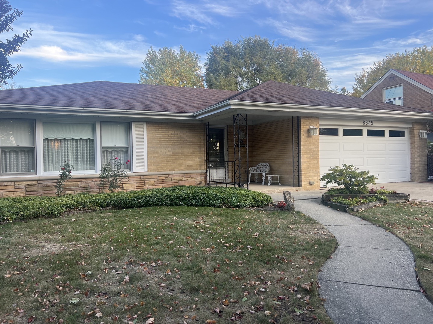 a front view of a house with garden