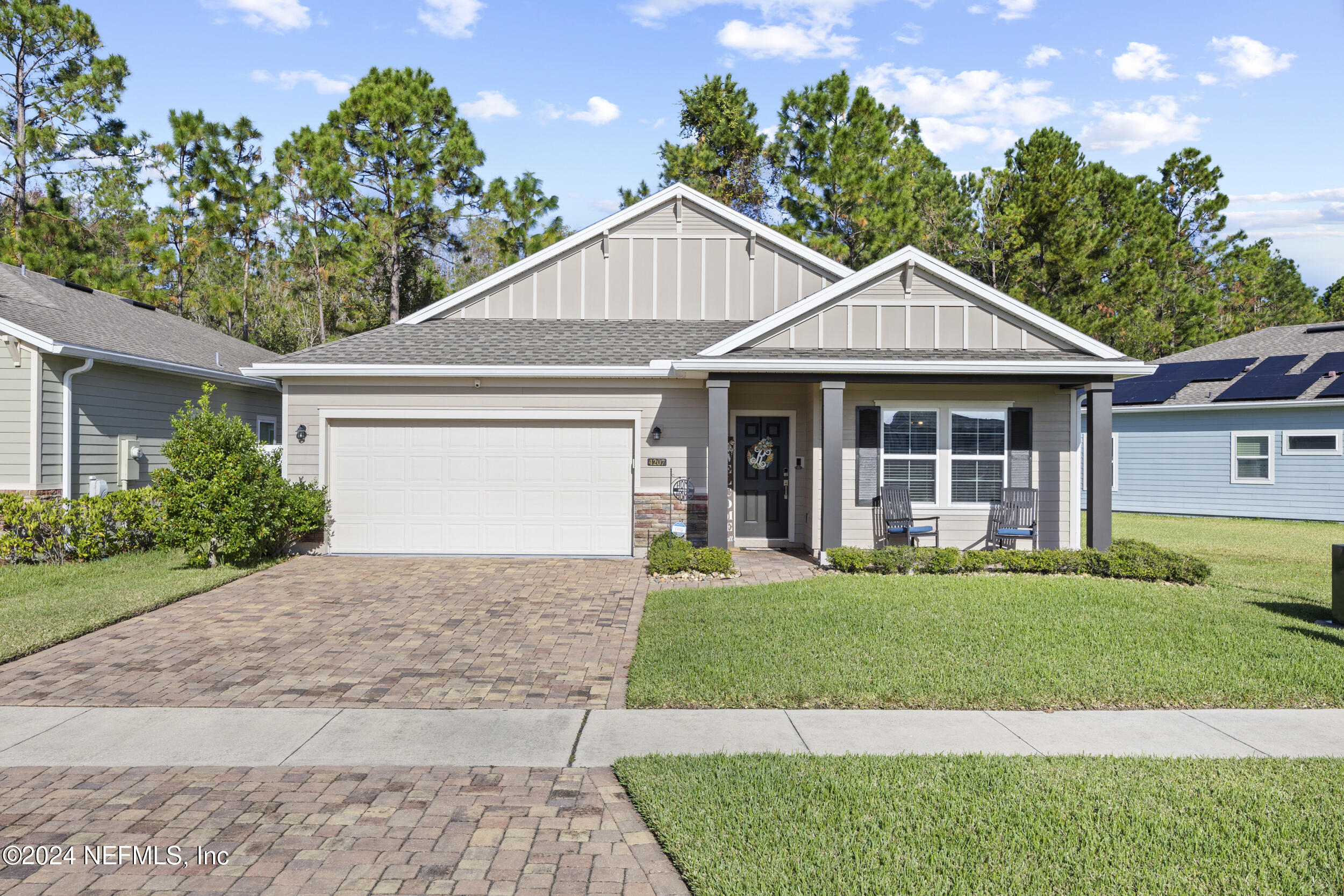 a front view of a house with a yard