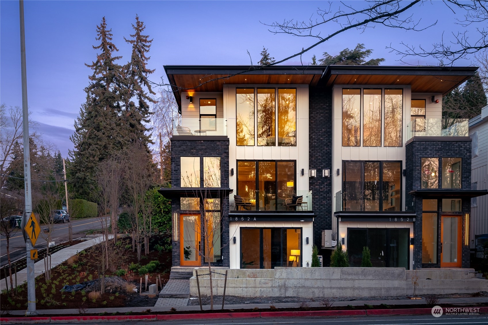 a front view of a house with large windows