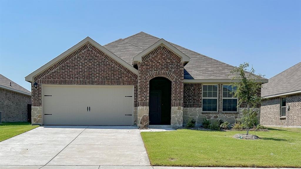 front view of a house with a yard