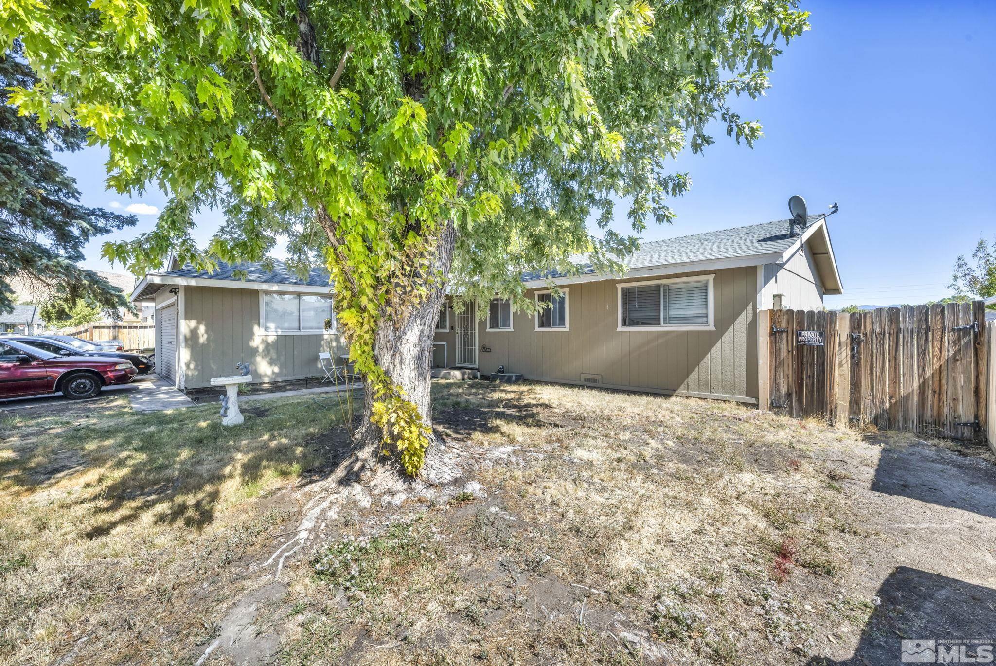 a view of a house with a yard