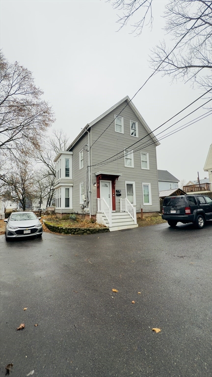 a view of a car parked in front of a house