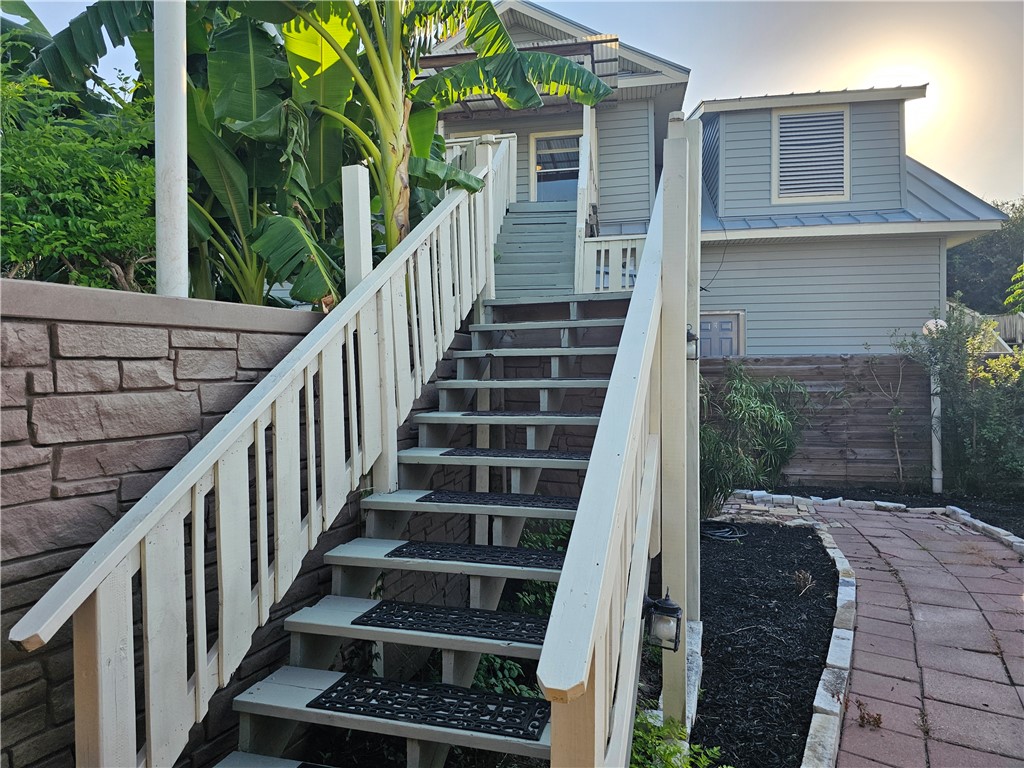 a view of a balcony with wooden floor