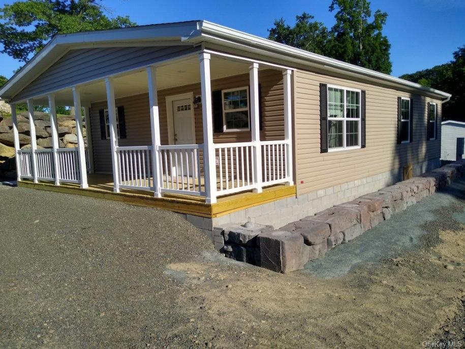 View of property exterior with a porch