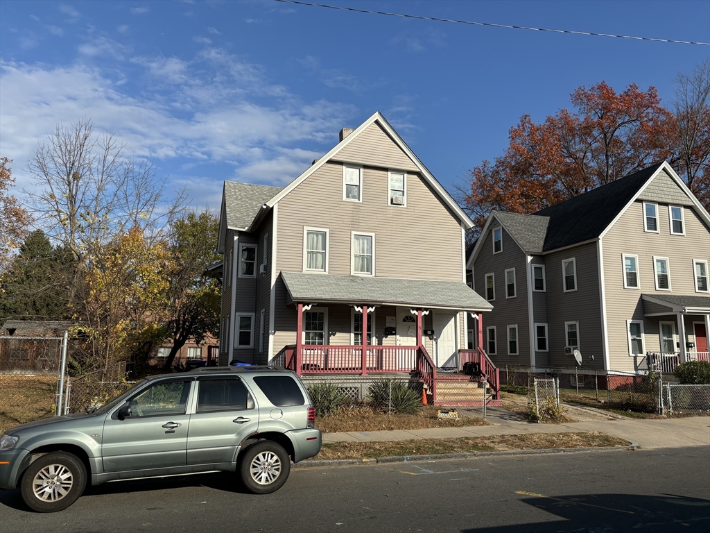 a view of a car park in front of house