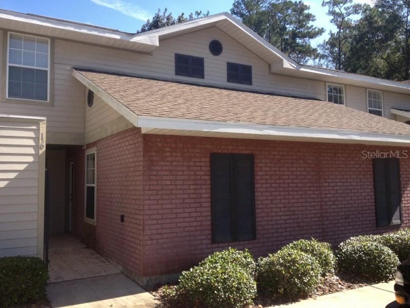 a front view of a house with garage