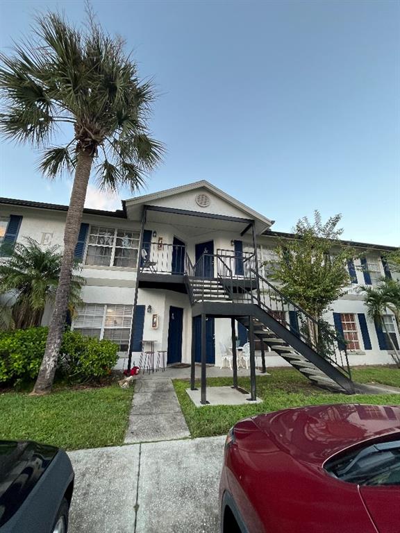 a front view of a house with yard and porch