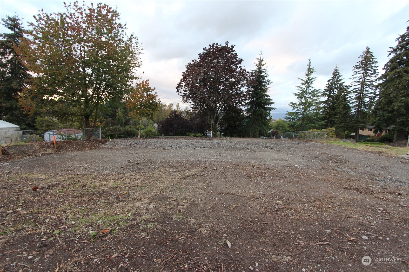 a view of outdoor space with trees all around