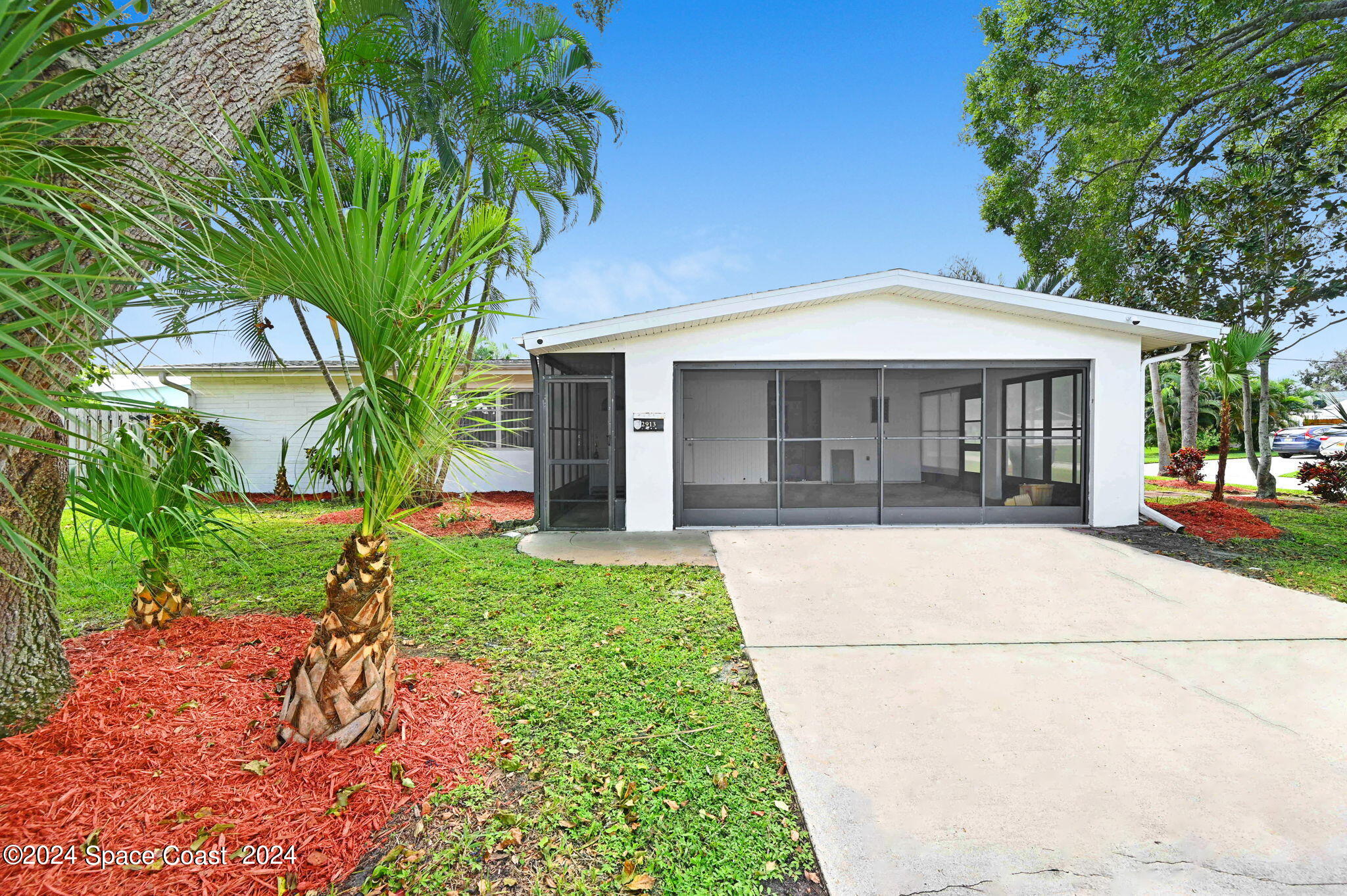 a house with a tree in front of it