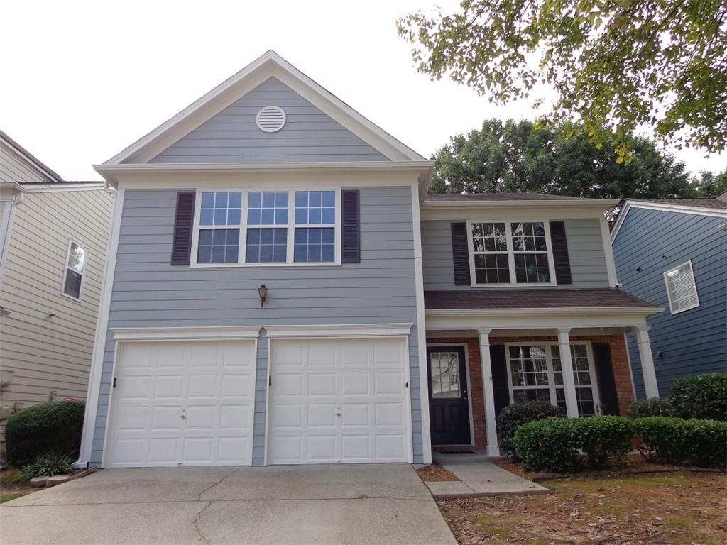 a front view of a house with a garage