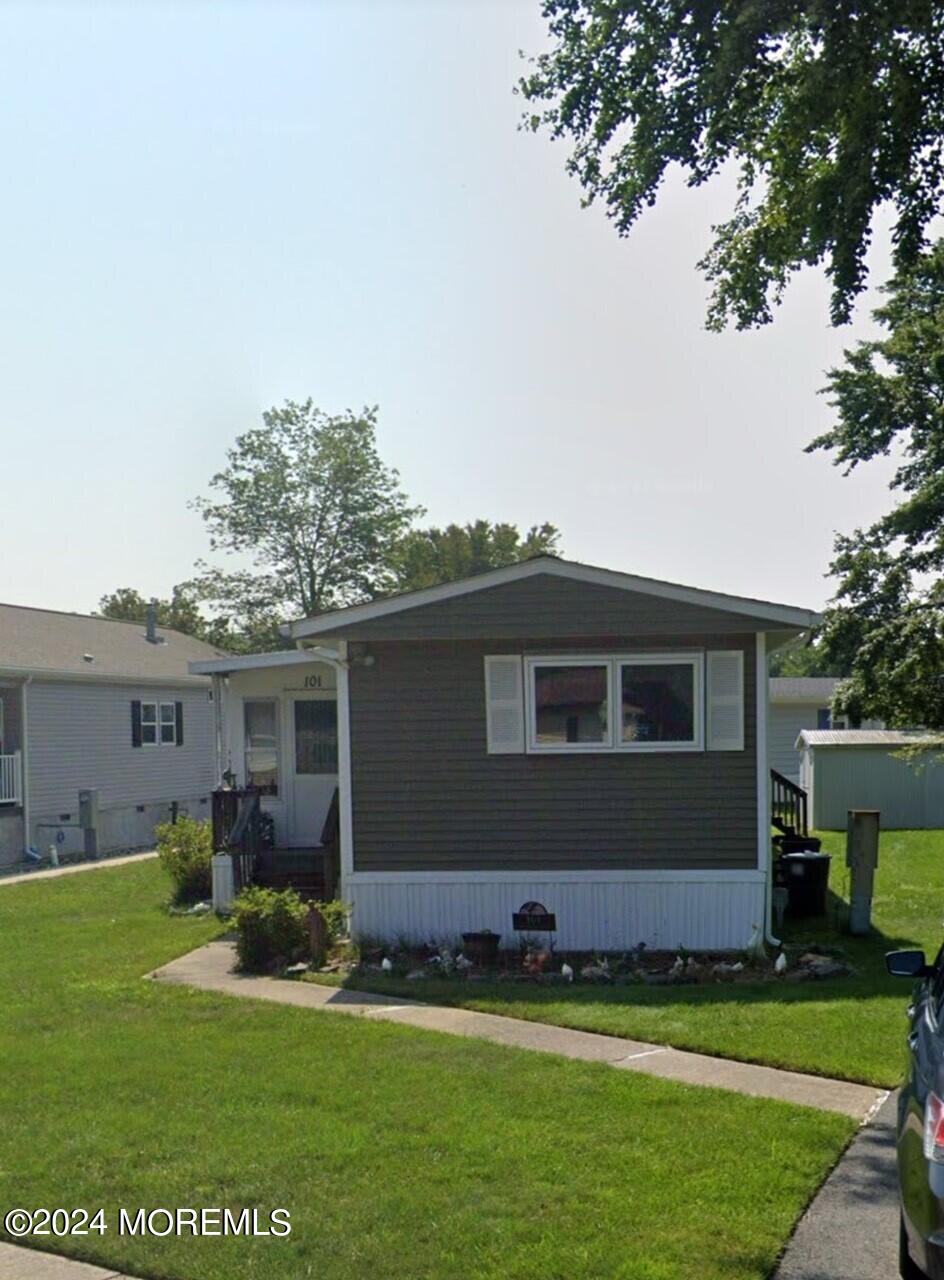 a house view with swimming pool in front of it