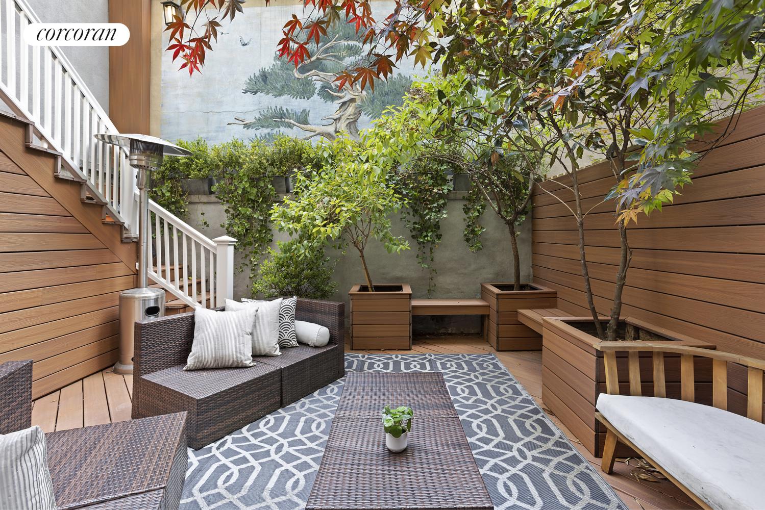 a view of a patio with couches and potted plants