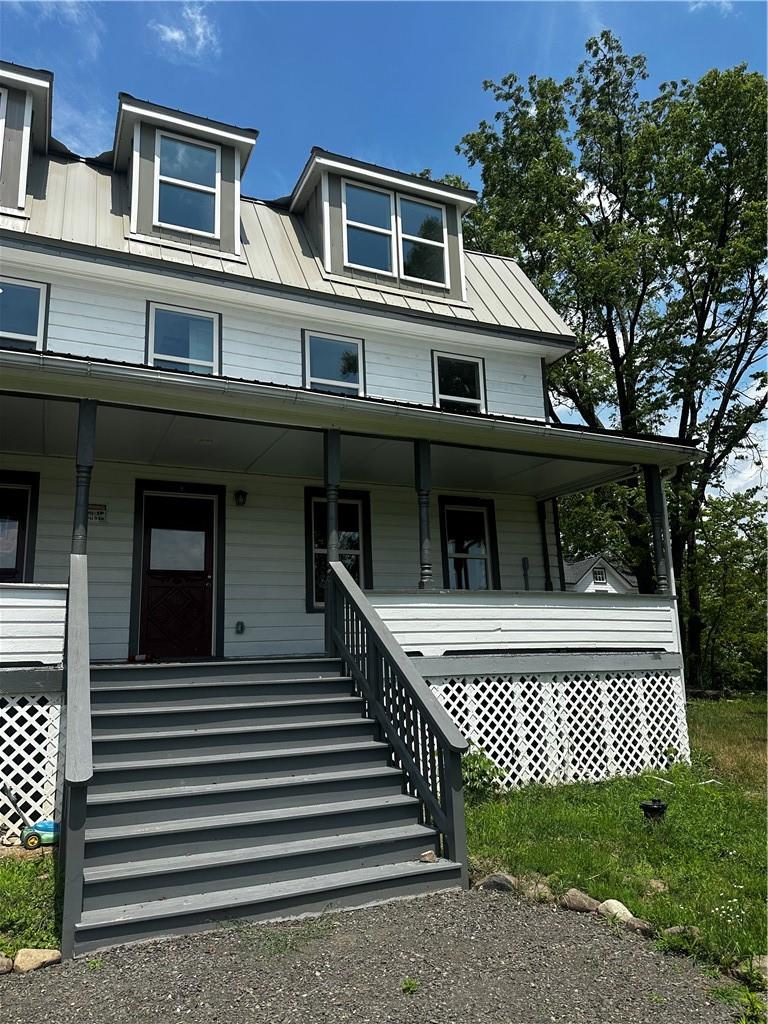 View of front of property featuring covered porch