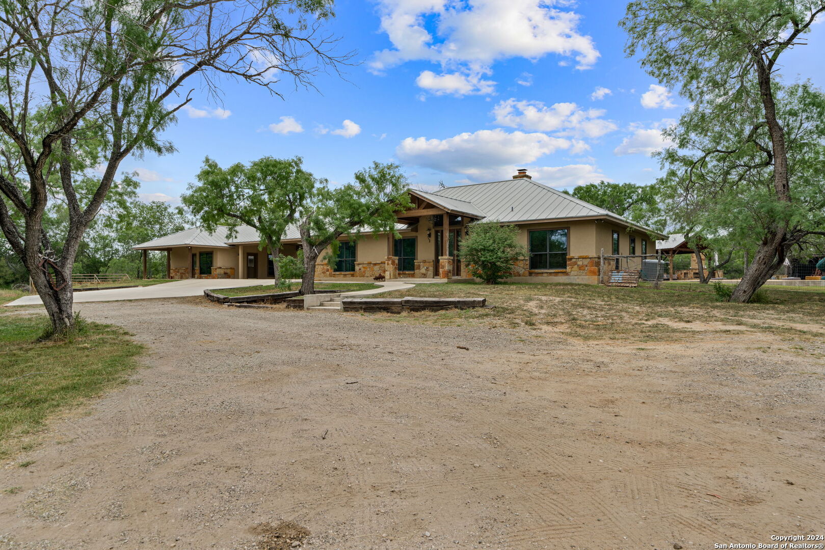 a view of a house with large tree