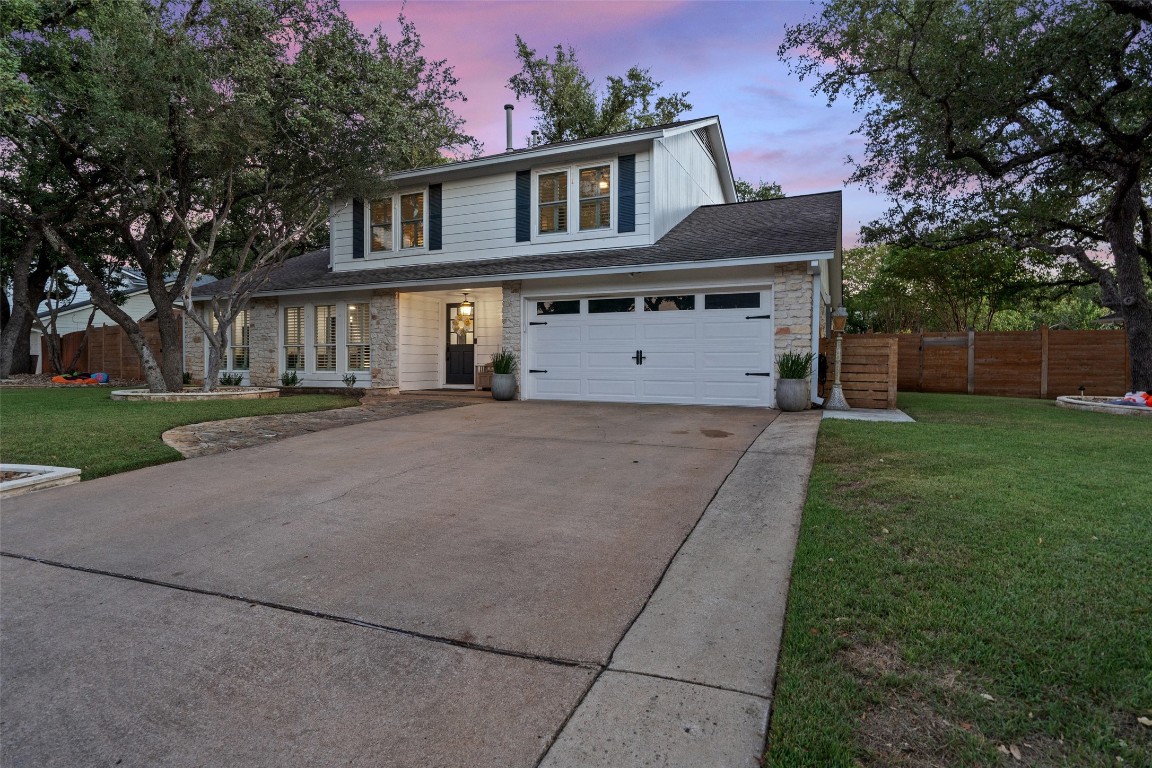 a front view of a house with garden