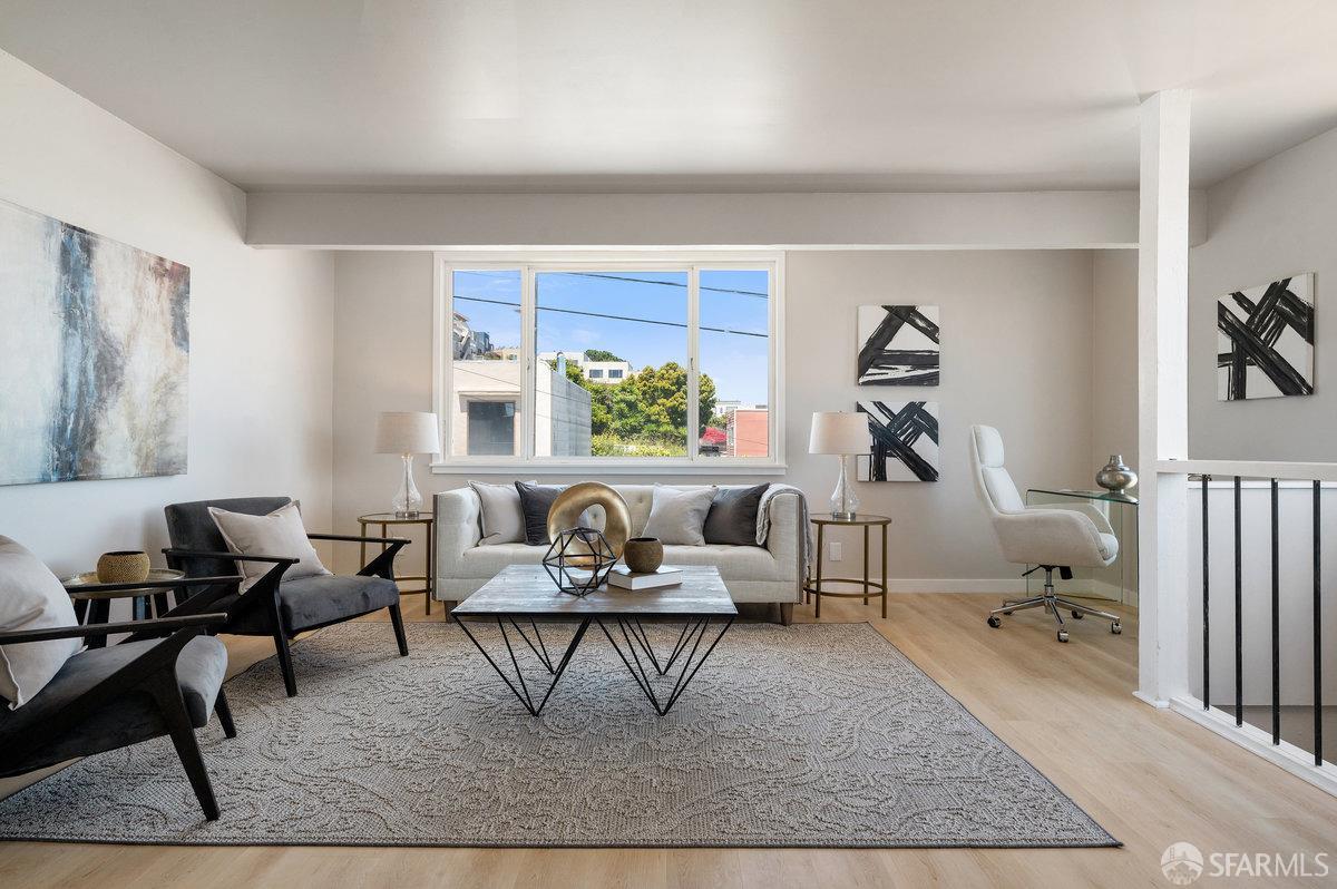 a living room with furniture and rug