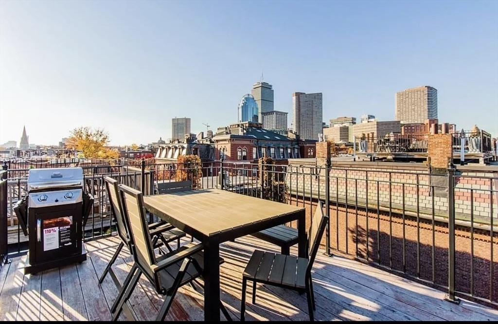 a view of a balcony with an outdoor seating