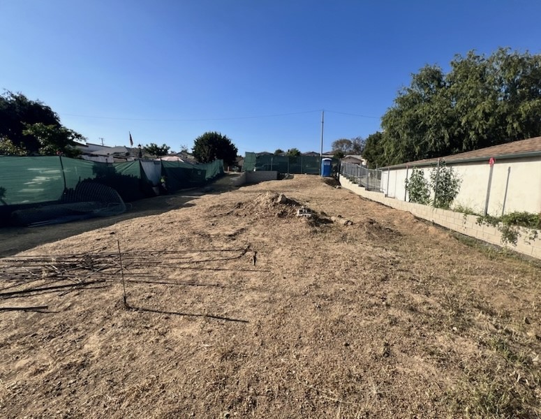 a view of a backyard of the house