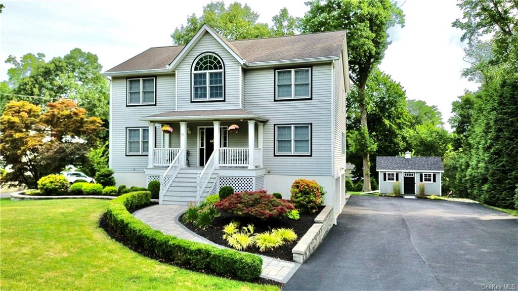 a front view of a house with garden