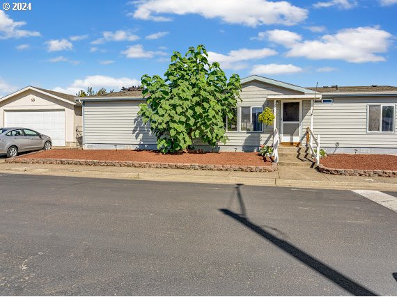 a house with yard in front of it