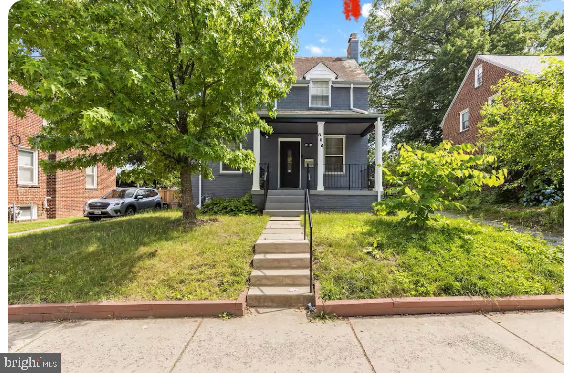 front view of a house with a yard