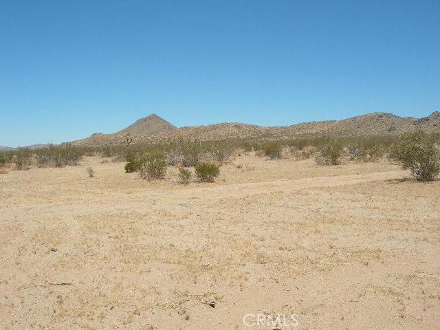 a view of ocean with a mountain in the background