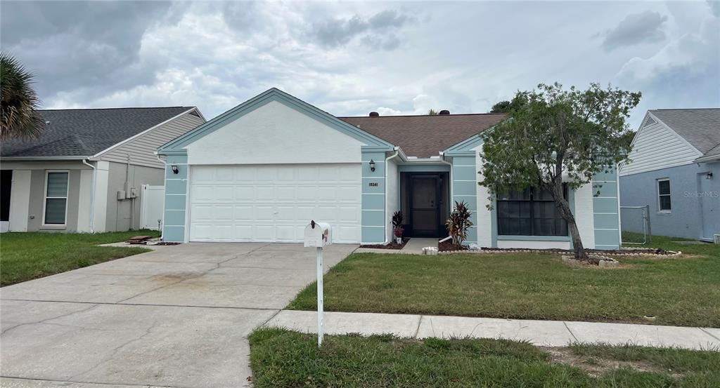 front view of a house with a yard