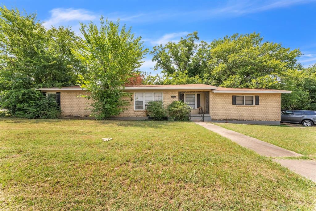 front view of a house with a yard