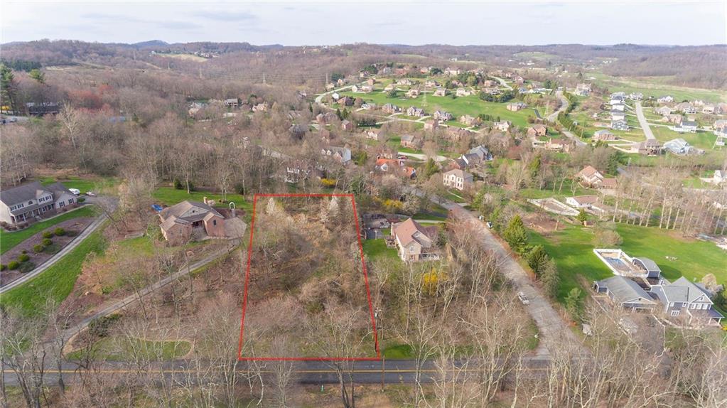 APPROXIMATE outline of land. Frontage on Hills Church rd and extends up between last home on Chapel Hill Ct