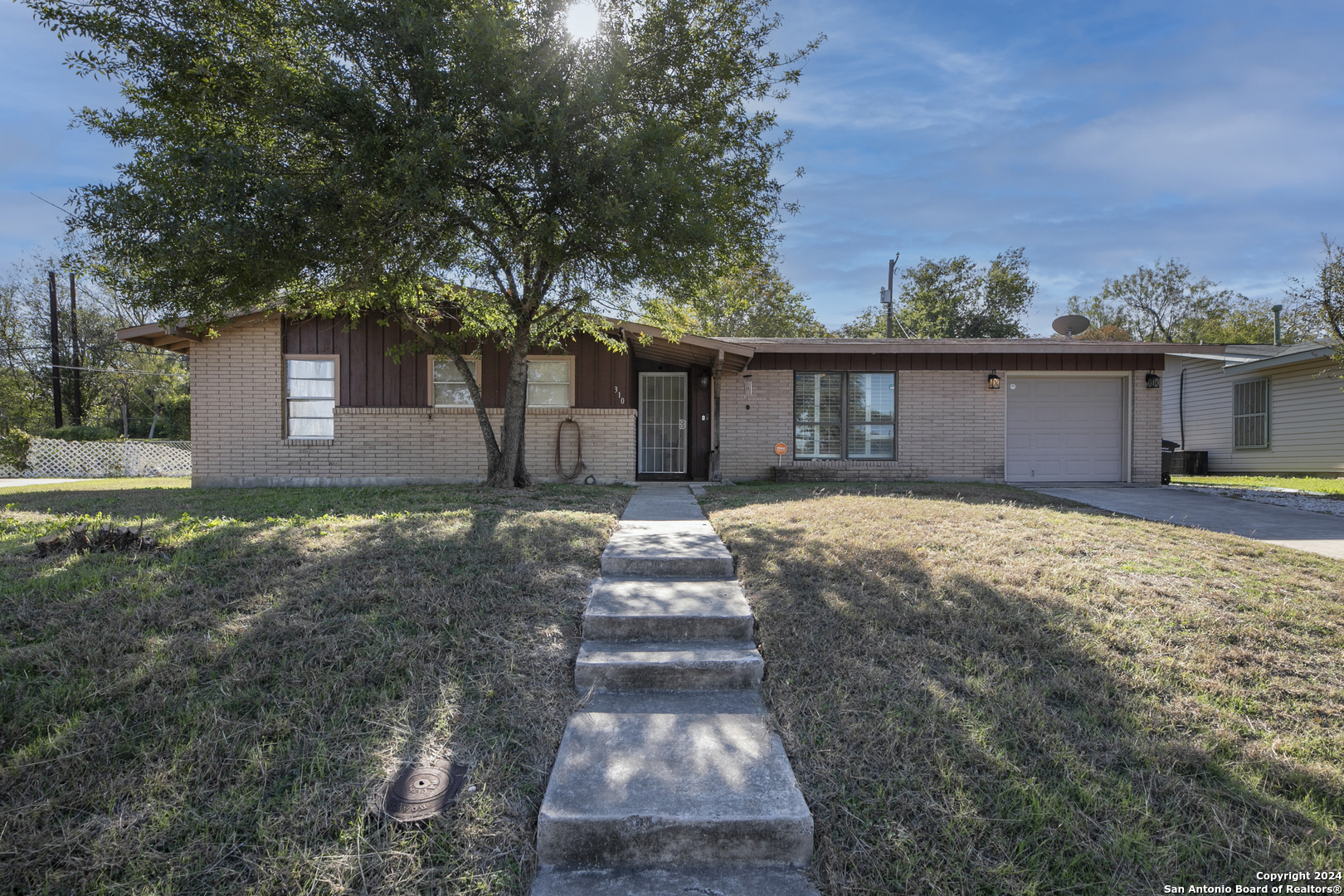 front view of a house with a yard