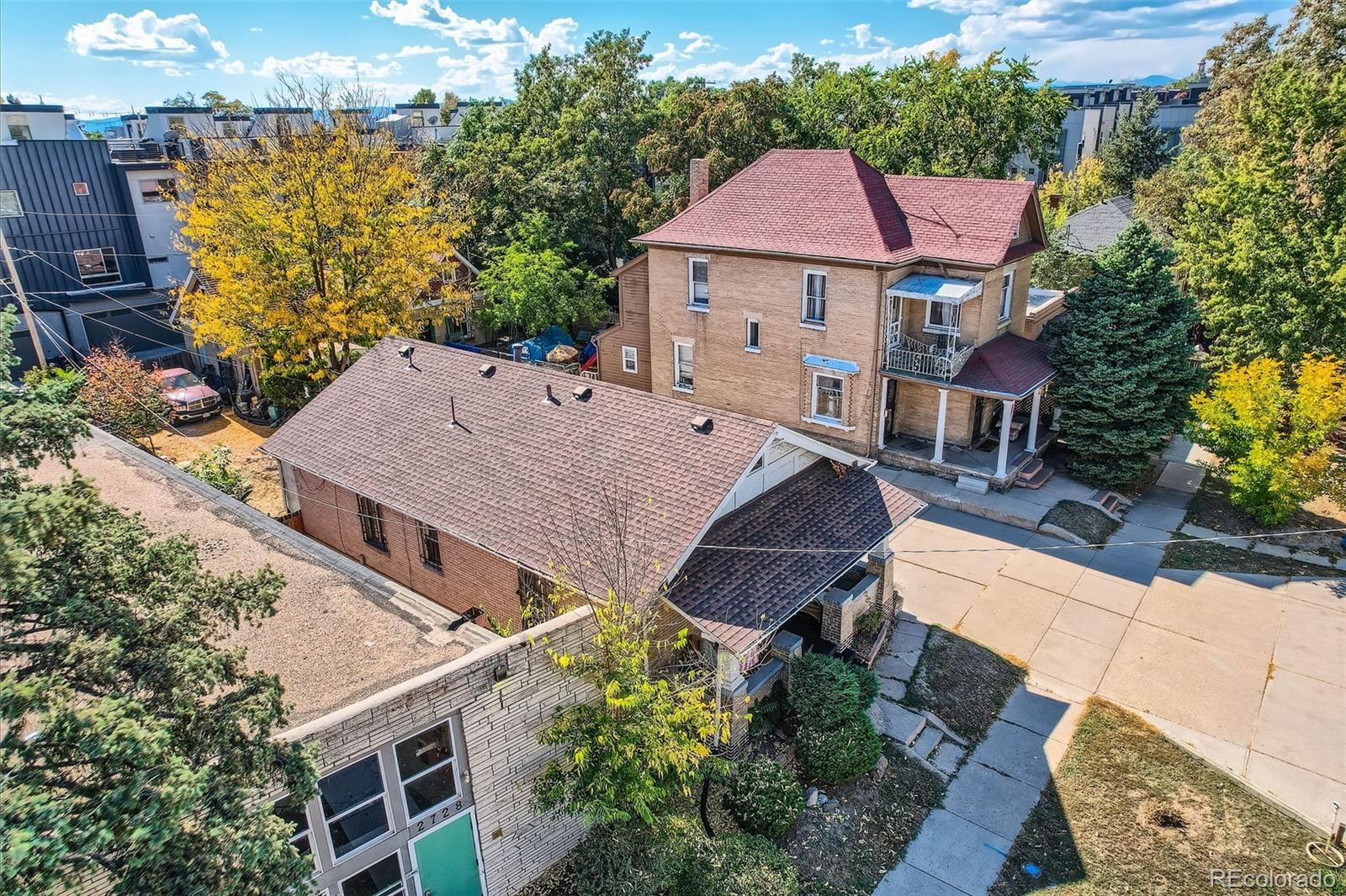 an aerial view of a house with table and chairs