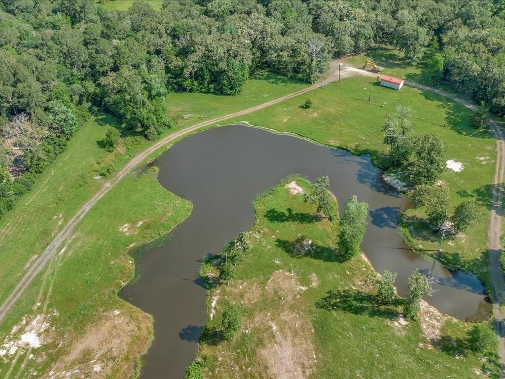 an aerial view of a golf course with swimming pool