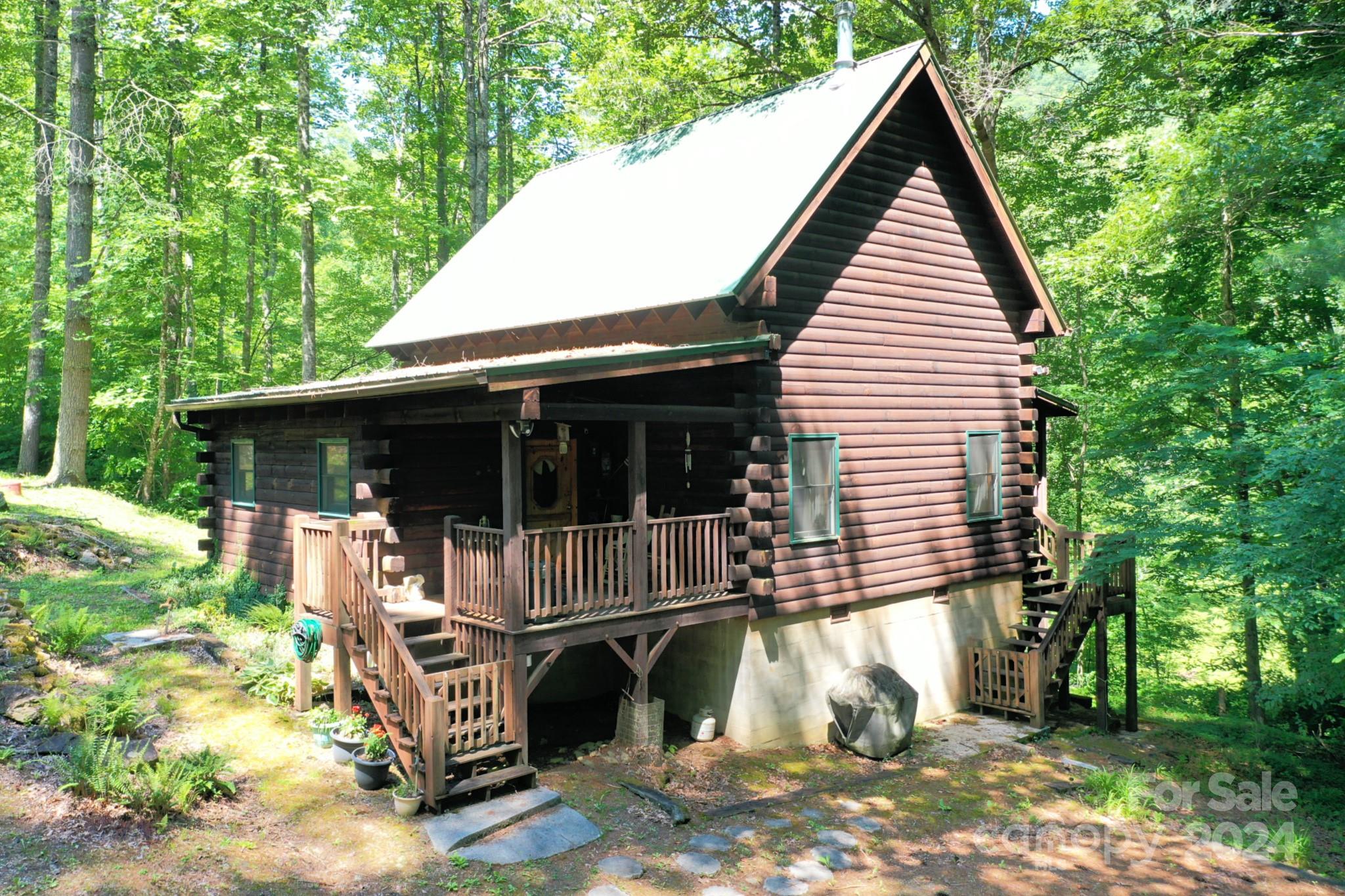 a view of house with backyard space and sitting area