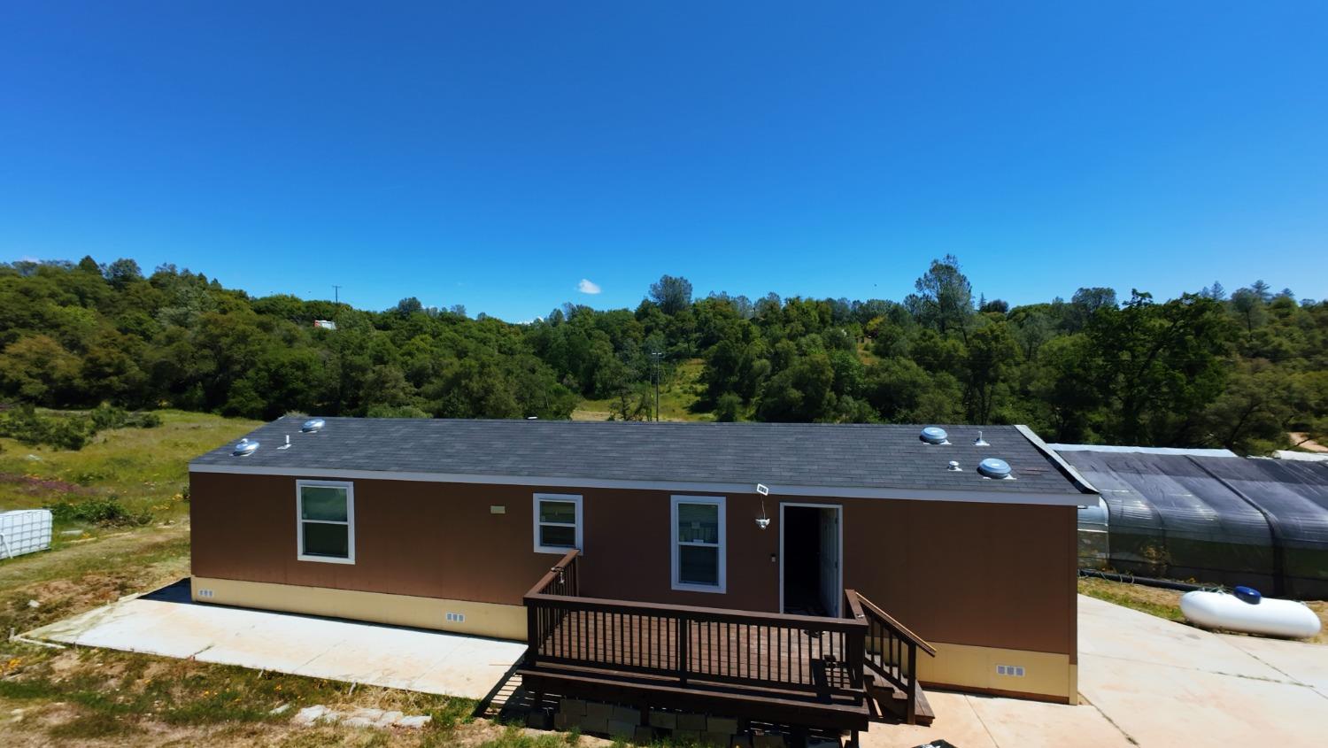 a aerial view of a house with a big yard