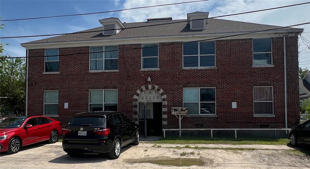 a front view of a house with parking