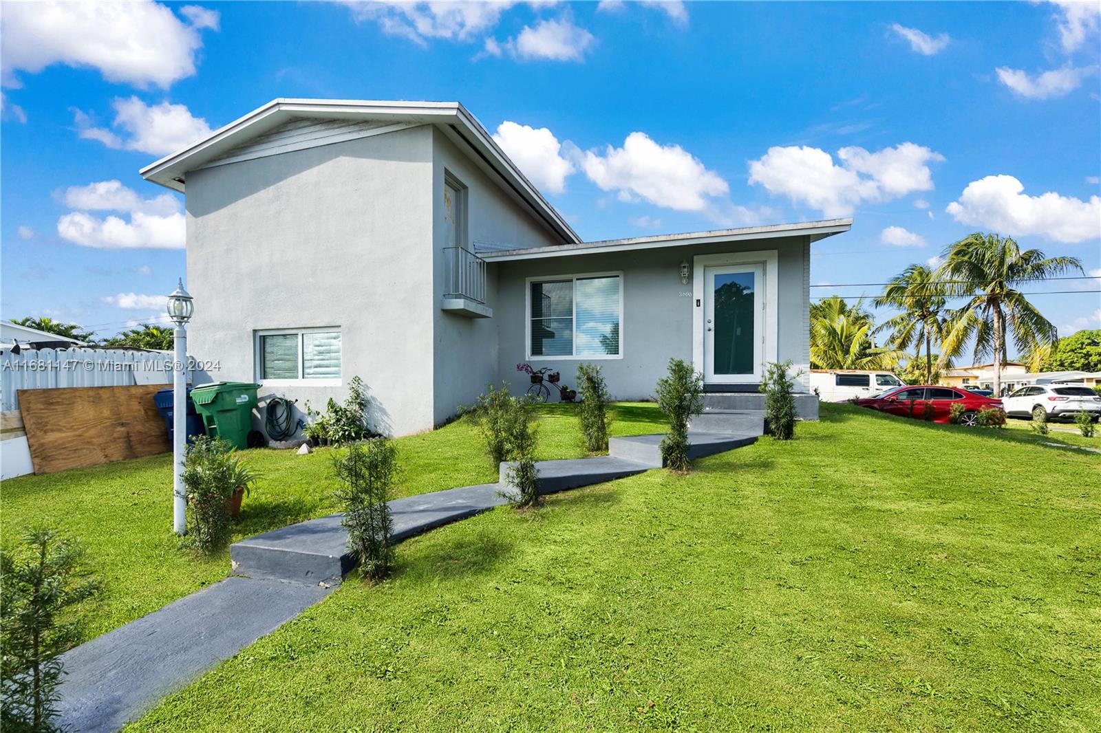 a view of an house with backyard space and garden