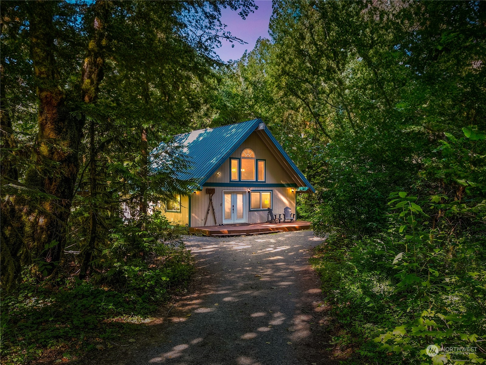 a view of wooden house with a yard