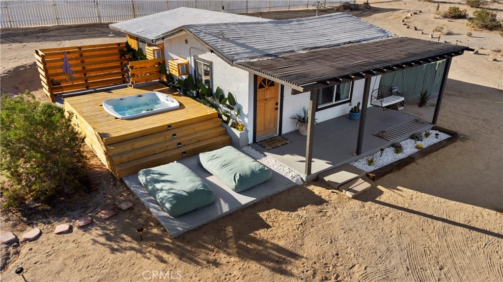 a roof deck with table and chairs