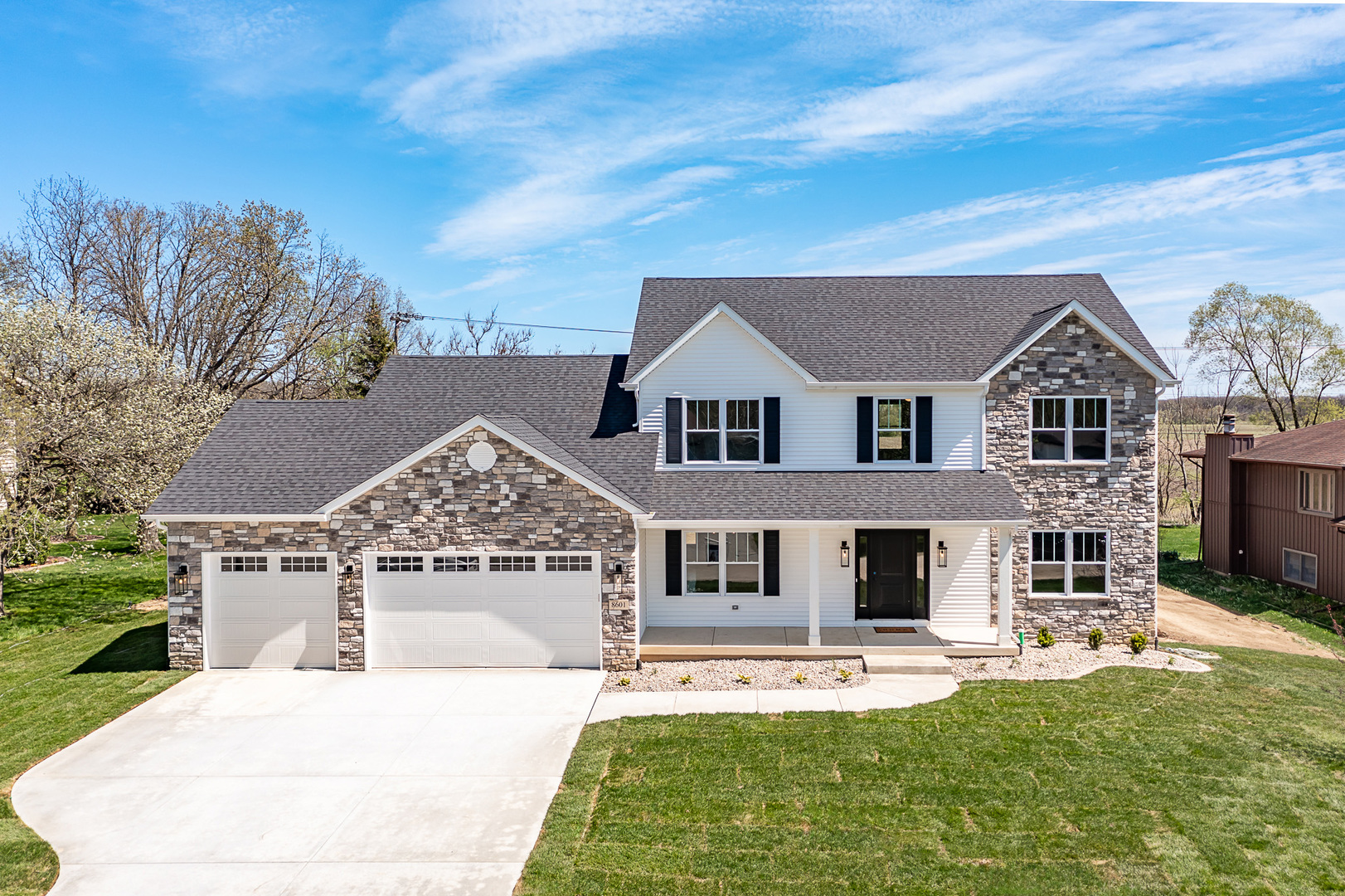 front view of a house with a yard